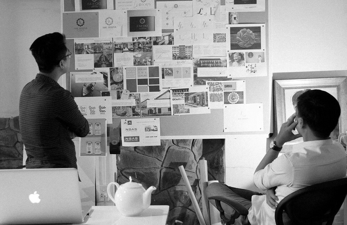 Brand identity concepts being reviewed in the CCVBRAND studio